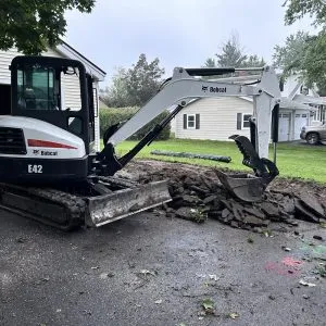 Bobcat E42 excavator working on residential land excavation