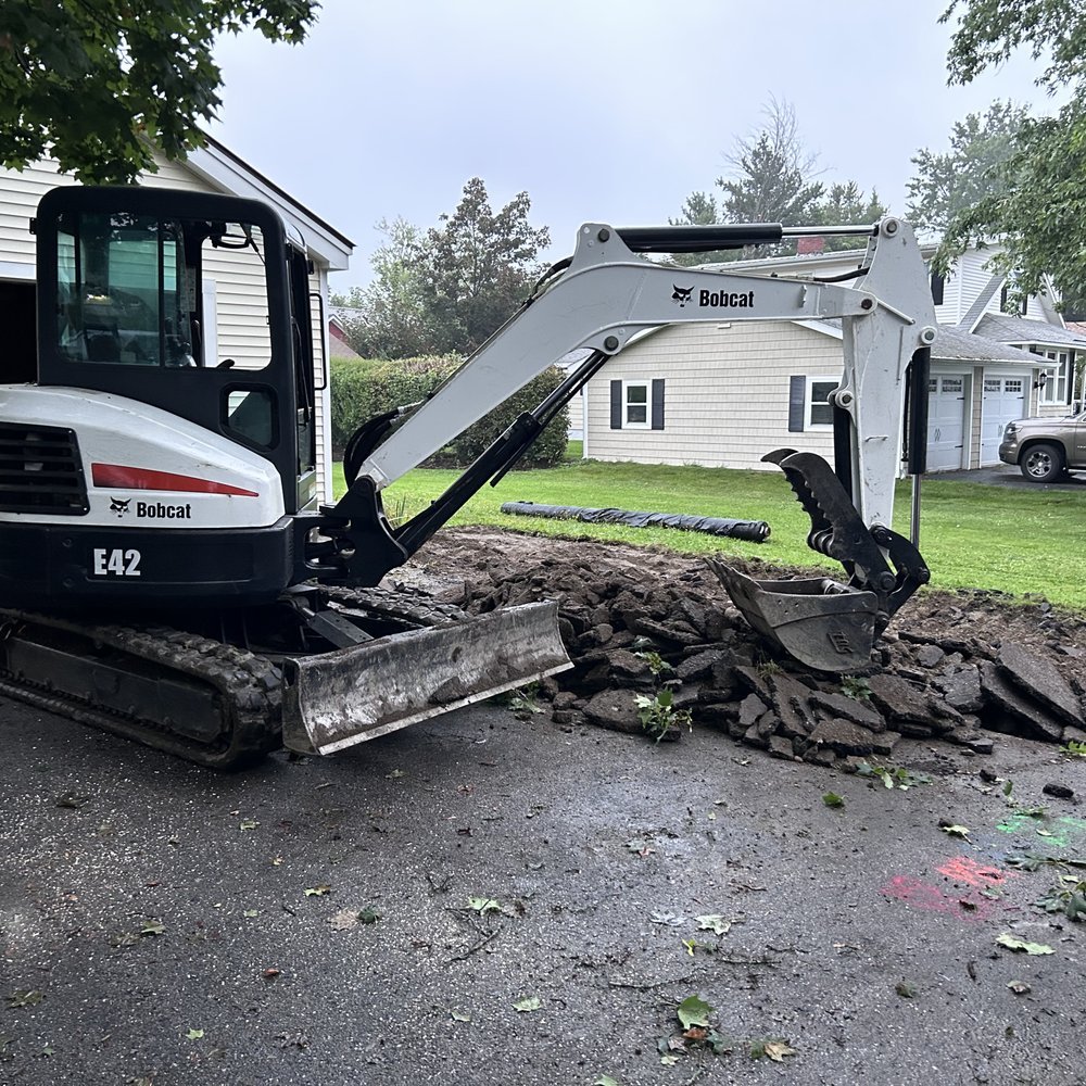 Bobcat E42 excavator working on residential land excavation