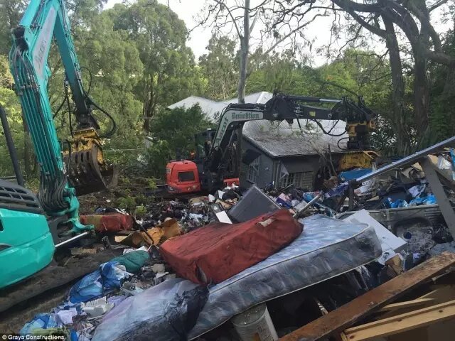 Small excavator is going to landfill