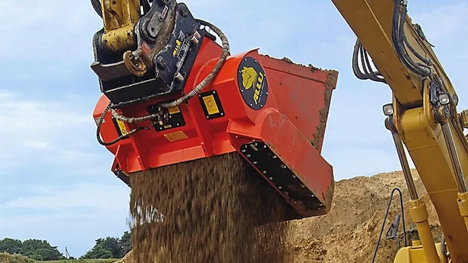 Excavator with screening bucket sifting soil at construction site