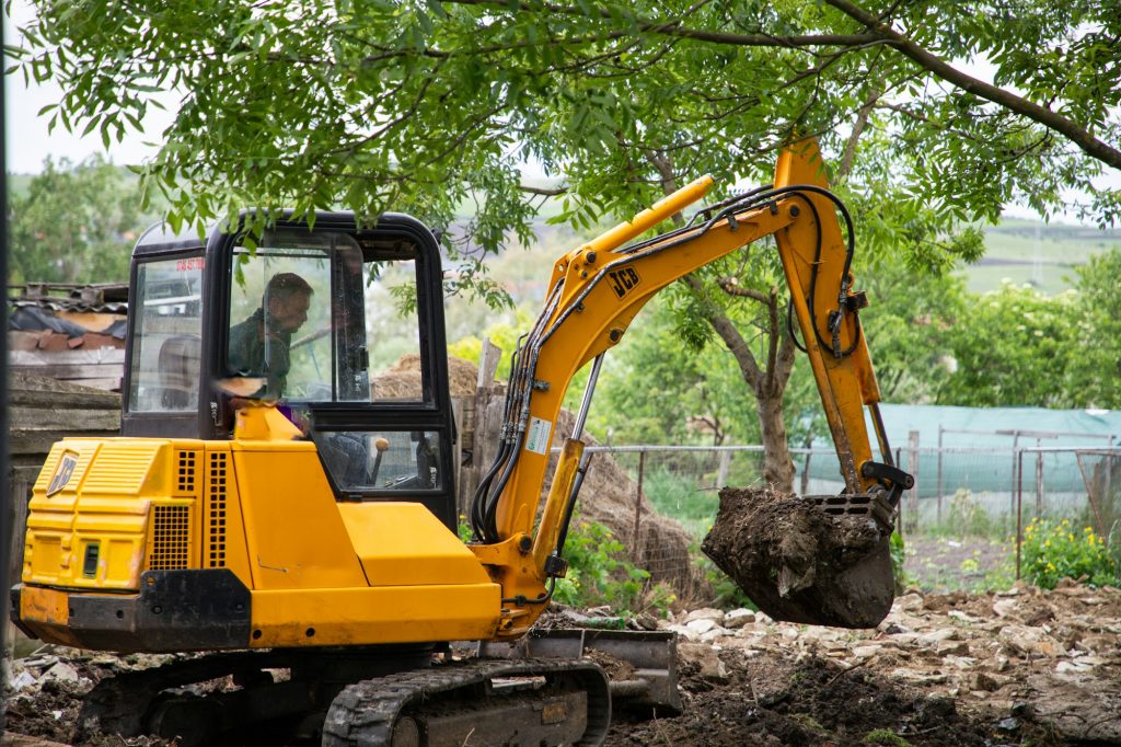 excavator with Bucket lift up are digging the soil in the construction site on