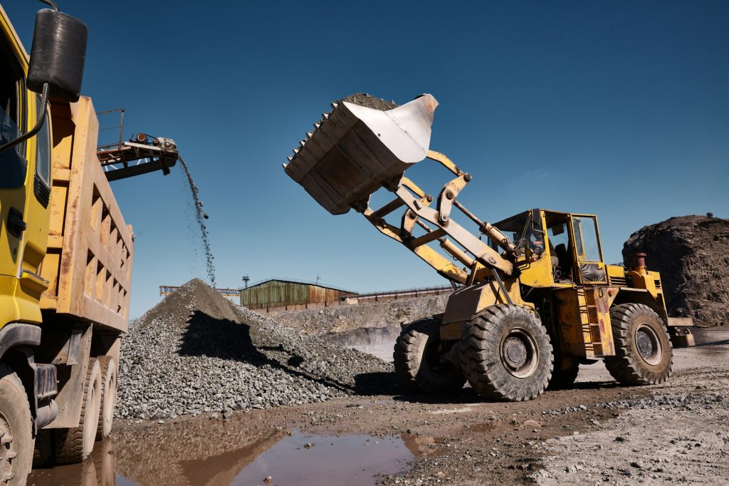 Front loading excavator loading the truck