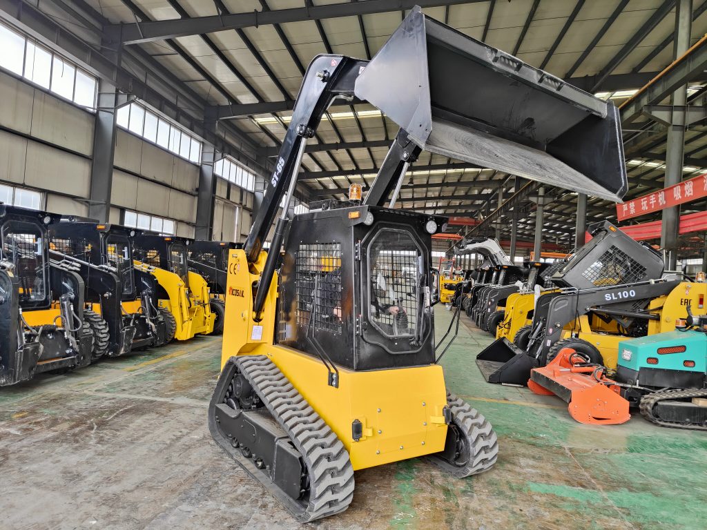 Yellow skid steer loaders in industrial warehouse