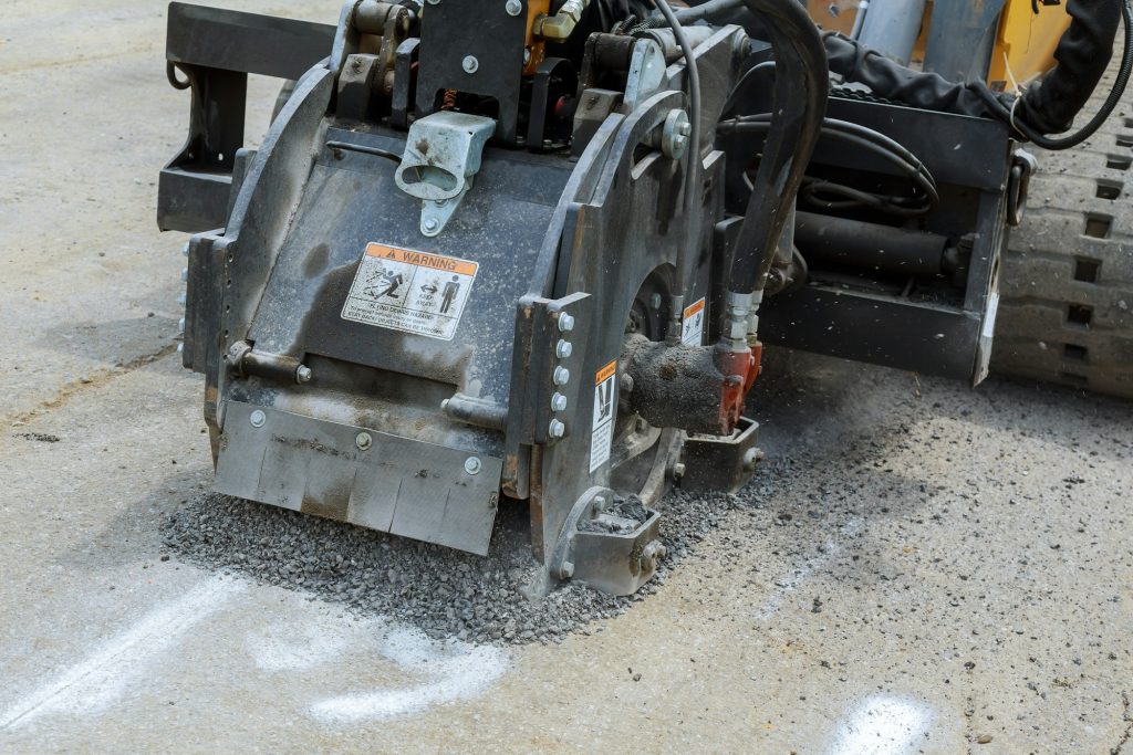 Milling of asphalt for road repair of roads